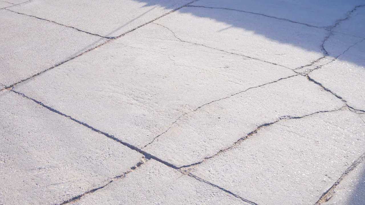 Cracked concrete driveway in New York